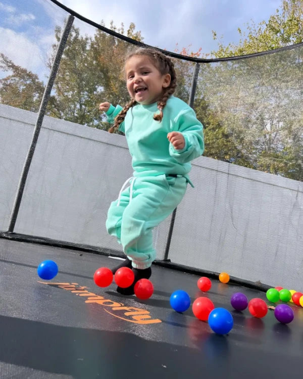 baby kid jumping on jumpfly trampoline