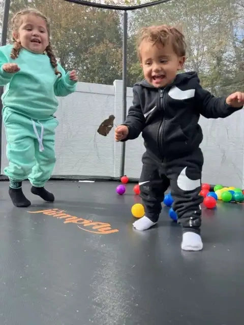 baby kids jumping on jumpfly trampoline